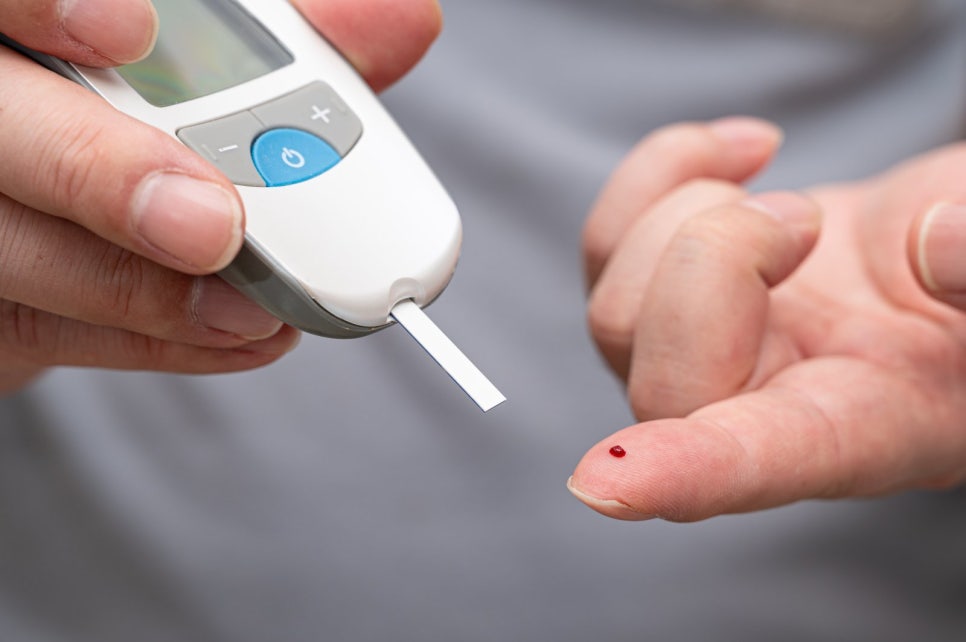 Blood glucose testing with a glucose meter and a drop of blood from a fingertip