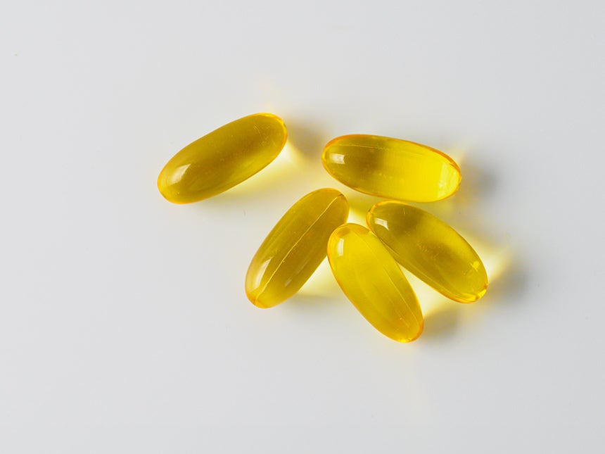 Five golden omega-3 softgel capsules that support the oil layer of the tear film