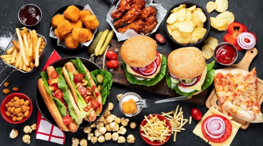 Spread of burgers, fries, pizza and other high-sodium fast food